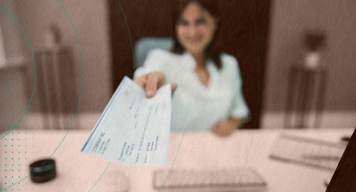 HR person handing out a payroll check